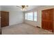 Cozy living room with a ceiling fan, and a door leading to another room at 439 Kershaw Country Club Rd, Kershaw, SC 29067