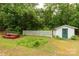 Backyard featuring an outbuilding and picnic table at 439 Kershaw Country Club Rd, Kershaw, SC 29067