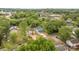 Aerial view of a new home surrounded by lush trees and a neighborhood at 518 Herms Ave, Mount Holly, NC 28120