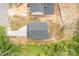 Aerial view of a new home with a gray roof, long driveway, and green landscaping at 518 Herms Ave, Mount Holly, NC 28120