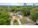 Aerial view of a new home with lush trees and a long concrete driveway at 518 Herms Ave, Mount Holly, NC 28120