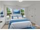 Bedroom with natural light and bright blue accents at 518 Herms Ave, Mount Holly, NC 28120