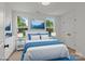 Beautifully designed bedroom with bright natural light and coordinated blue accents and stylish décor at 518 Herms Ave, Mount Holly, NC 28120