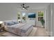 Bright bedroom with large windows, neutral walls, and a ceiling fan at 518 Herms Ave, Mount Holly, NC 28120