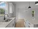 Bright modern kitchen with white cabinets, granite countertops, and stainless appliances at 518 Herms Ave, Mount Holly, NC 28120