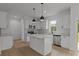 Modern kitchen showcases white cabinets, stainless appliances, granite counters, and a central island at 518 Herms Ave, Mount Holly, NC 28120