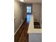 Open hallway area with hardwood flooring and a stairwell leading down to the lower level at 521 Donatello Ave, Charlotte, NC 28205