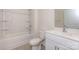 Bright bathroom features a shower-tub, tile floors, toilet, and modern vanity with a mirror at 5523 Pamplona Way, Charlotte, NC 28214