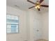 Bright bedroom featuring a window, ceiling fan with lights, and a double door closet at 5523 Pamplona Way, Charlotte, NC 28214