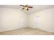 Bedroom with plush carpeting, ceiling fan and two closet doors at 5523 Pamplona Way, Charlotte, NC 28214