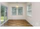 Bright breakfast nook with wood-look flooring and sliding glass doors at 5523 Pamplona Way, Charlotte, NC 28214