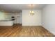Open concept layout with dining area flowing into a modern kitchen with stainless appliances at 5523 Pamplona Way, Charlotte, NC 28214