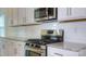 Close-up of a stylish kitchen with granite counters, stainless steel appliances, and white subway tile at 5523 Pamplona Way, Charlotte, NC 28214