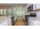 Modern kitchen featuring stainless steel appliances, granite countertops, and subway tile backsplash at 5523 Pamplona Way, Charlotte, NC 28214