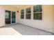 Covered patio offers sliding door access to the home's interior and three large windows at 5523 Pamplona Way, Charlotte, NC 28214