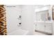 Bright bathroom features a shower and bath combination with white tiling and double sink vanity at 5536 Pamplona Way, Charlotte, NC 28214