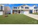Charming two-story home with stone accents, a well-manicured lawn, and a welcoming front porch at 5536 Pamplona Way, Charlotte, NC 28214