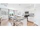 Bright kitchen with white cabinetry, stainless steel appliances, and a large island perfect for entertaining at 5536 Pamplona Way, Charlotte, NC 28214