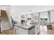 Modern kitchen featuring granite countertops, stainless steel appliances, and an island with seating at 5536 Pamplona Way, Charlotte, NC 28214