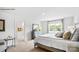 Bright primary bedroom with a view, neutral decor, and a doorway to the ensuite bathroom and closet at 5536 Pamplona Way, Charlotte, NC 28214