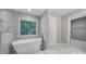 Bright bathroom featuring a soaking tub and large window at 5633 Open Book Ln, Charlotte, NC 28270
