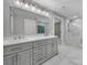 Bathroom featuring double vanity and shower at 5633 Open Book Ln, Charlotte, NC 28270