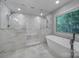 Modern bathroom with separate tub and glass shower at 5633 Open Book Ln, Charlotte, NC 28270