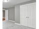 Bedroom with gray walls, carpet, and closet doors at 5633 Open Book Ln, Charlotte, NC 28270