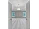 View from doorway to large bedroom with chandelier and two windows at 5633 Open Book Ln, Charlotte, NC 28270