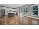 Bright kitchen featuring stainless steel appliances, a kitchen island, and ample natural light at 5633 Open Book Ln, Charlotte, NC 28270