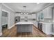 Modern kitchen featuring a large island, stainless steel appliances, and plenty of counter space at 5633 Open Book Ln, Charlotte, NC 28270