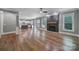 Spacious living room featuring a modern fireplace, abundant natural light, and gorgeous hardwood floors at 5633 Open Book Ln, Charlotte, NC 28270