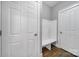 Hallway with a built-in nook featuring a bench and hooks for storing belongings at 5633 Open Book Ln, Charlotte, NC 28270