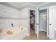 Well-maintained bathroom with a separate tub, an open closet, and ceramic tile floors at 600 Old Hardin Rd, Dallas, NC 28034