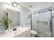 Bright bathroom with white cabinets, tiled shower and glass doors at 600 Old Hardin Rd, Dallas, NC 28034