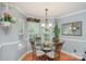 Bright dining room featuring a glass table, hardwood floors and corner windows at 600 Old Hardin Rd, Dallas, NC 28034