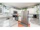 Well-lit kitchen boasts white cabinets, subway tile backsplash, and stainless steel appliances at 600 Old Hardin Rd, Dallas, NC 28034