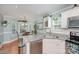 Bright kitchen featuring granite countertops, stainless steel appliances, and a breakfast nook at 600 Old Hardin Rd, Dallas, NC 28034