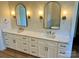Bathroom with double sink vanity, granite counters, and modern lighting at 603 Turnberry Ct, Albemarle, NC 28001