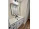 Modern bathroom featuring a framed mirror and a white vanity with black hardware at 603 Turnberry Ct, Albemarle, NC 28001