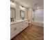 Bathroom with a shower-tub combo and double sink vanity with white cabinets at 603 Turnberry Ct, Albemarle, NC 28001