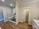 Bright bathroom features an open marble tiled shower and neutral walls at 603 Turnberry Ct, Albemarle, NC 28001