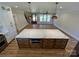 Bright open kitchen boasts a large marble island, custom cabinets, and stainless steel appliances at 603 Turnberry Ct, Albemarle, NC 28001