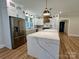 This custom kitchen features stainless steel appliances, ample cabinet space, and an oversized island at 603 Turnberry Ct, Albemarle, NC 28001