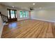 Expansive living room showcasing hardwood floors, recessed lighting, and a staircase to the second floor at 603 Turnberry Ct, Albemarle, NC 28001