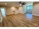Living room features wood-look floors and a ceiling fan at 603 Turnberry Ct, Albemarle, NC 28001