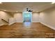 Living room features wood-look floors and a ceiling fan at 603 Turnberry Ct, Albemarle, NC 28001
