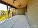 Large covered patio with ceiling fans, wood ceiling, and outdoor living space at 603 Turnberry Ct, Albemarle, NC 28001