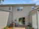 Back exterior view with sliding door and air conditioning unit on a concrete patio at 6457 Saint Bernard Way, Charlotte, NC 28269