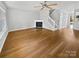 Open concept living area featuring beautiful hardwood floors and a fireplace at 6457 Saint Bernard Way, Charlotte, NC 28269